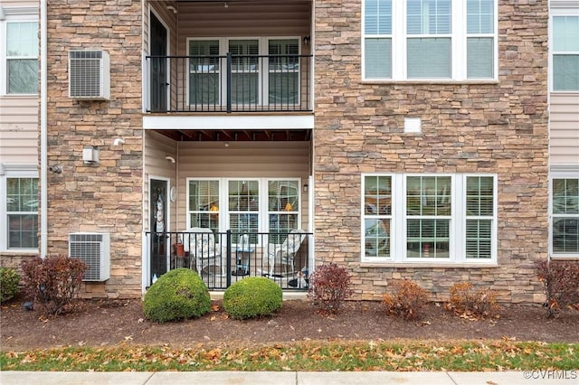 exterior space with stone siding and central air condition unit