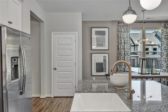 2013 Farmstead Mill Ct, Glen Allen, VA 23059 - kitchen featuring stainless steel refrigerator with ice dispenser, white cabinetry, wood finished floors, a sink, and stone countertops