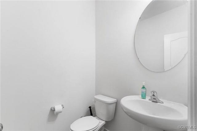 bathroom featuring sink and toilet