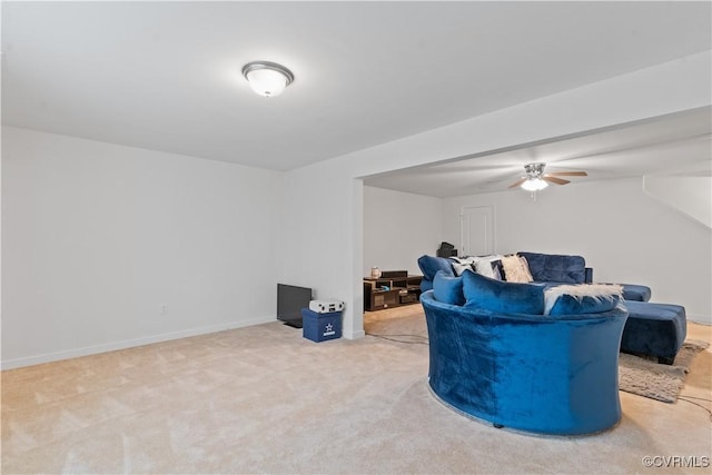 living area with carpet floors and ceiling fan