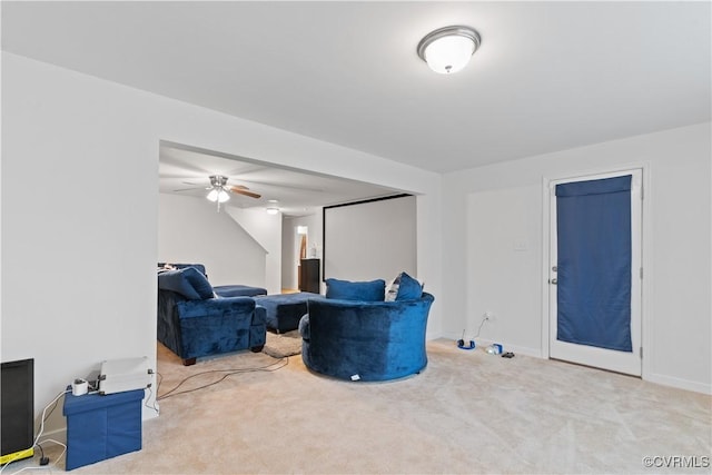 sitting room with ceiling fan and light carpet