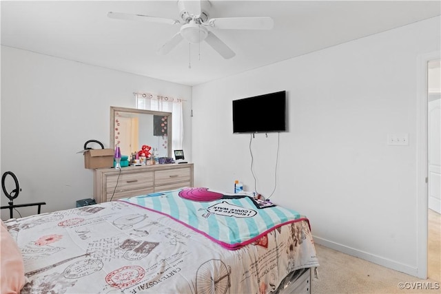 bedroom with ceiling fan and light carpet