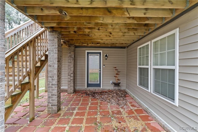 entrance to property featuring a patio