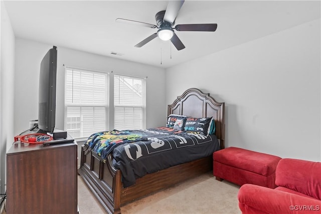 carpeted bedroom featuring ceiling fan