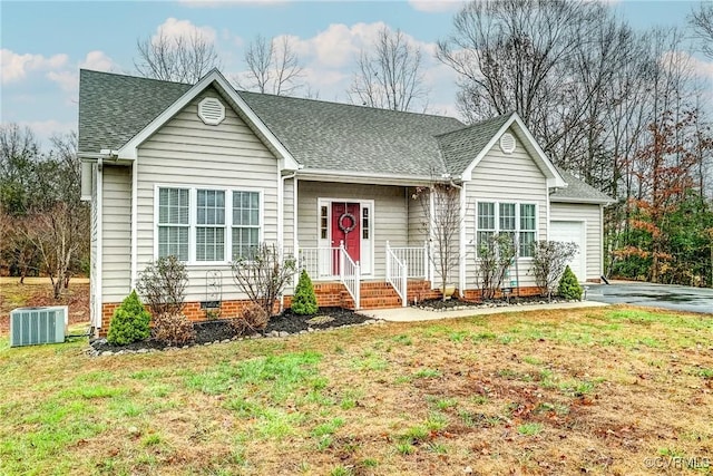 ranch-style home featuring a garage, a front yard, and central AC