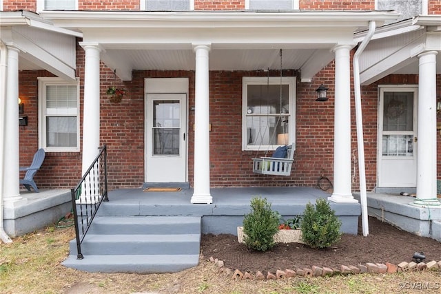 entrance to property featuring covered porch