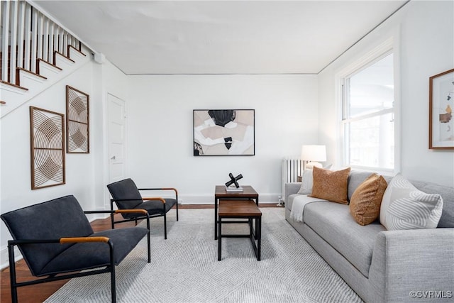 living room featuring light hardwood / wood-style floors and radiator