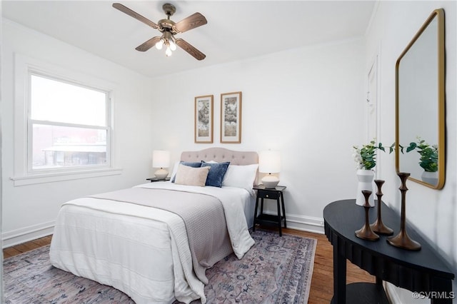 bedroom with hardwood / wood-style floors and ceiling fan