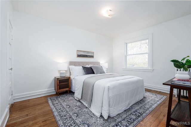 bedroom featuring dark wood-type flooring