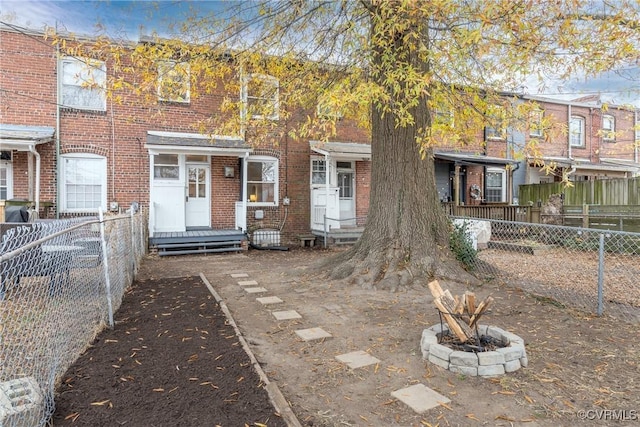 view of property with a fire pit