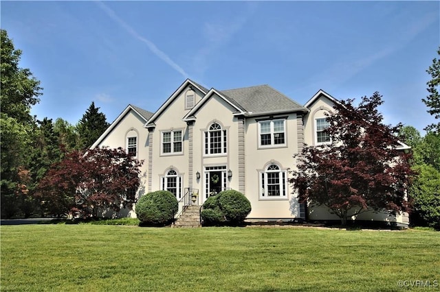 colonial home with a front yard