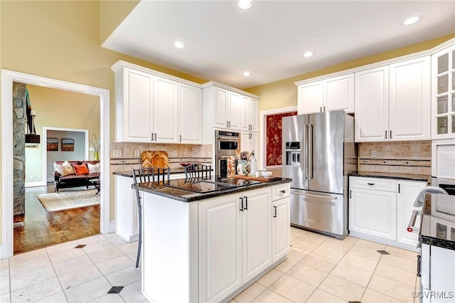 kitchen featuring appliances with stainless steel finishes and white cabinetry