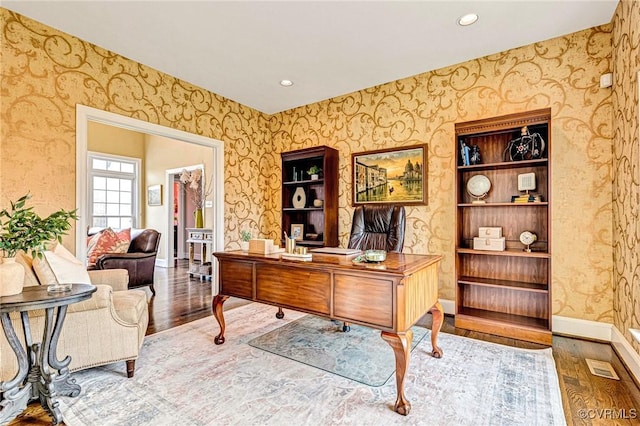 home office with hardwood / wood-style flooring