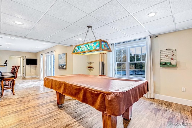 playroom featuring hardwood / wood-style floors, a paneled ceiling, and pool table