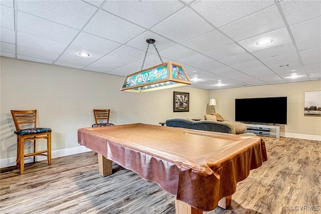 recreation room featuring hardwood / wood-style flooring, a drop ceiling, and billiards