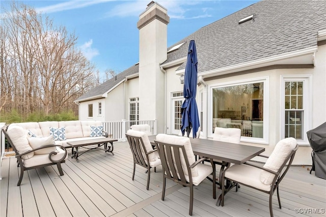 wooden deck featuring an outdoor living space