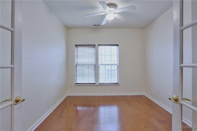 unfurnished room with light hardwood / wood-style flooring and ceiling fan