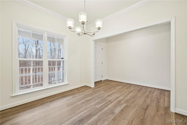 unfurnished dining area with a chandelier, light wood-type flooring, and ornamental molding