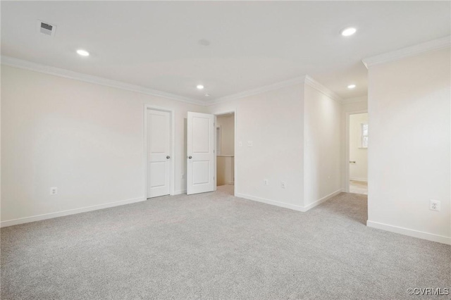 carpeted empty room featuring ornamental molding