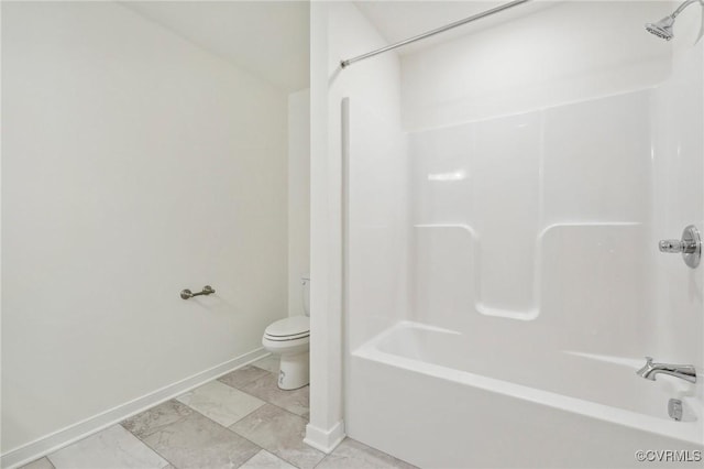 bathroom with washtub / shower combination and toilet