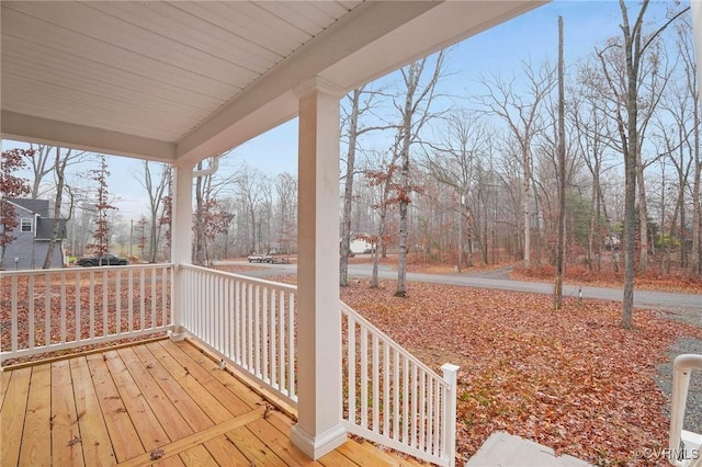 wooden terrace featuring covered porch