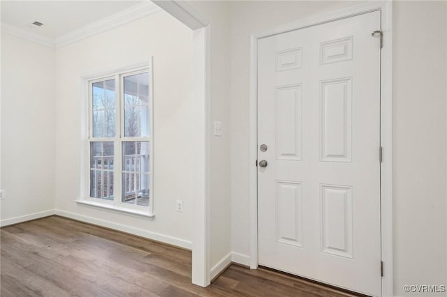 entrance foyer featuring hardwood / wood-style floors and crown molding