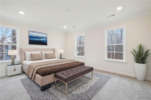 carpeted bedroom with ornamental molding and multiple windows