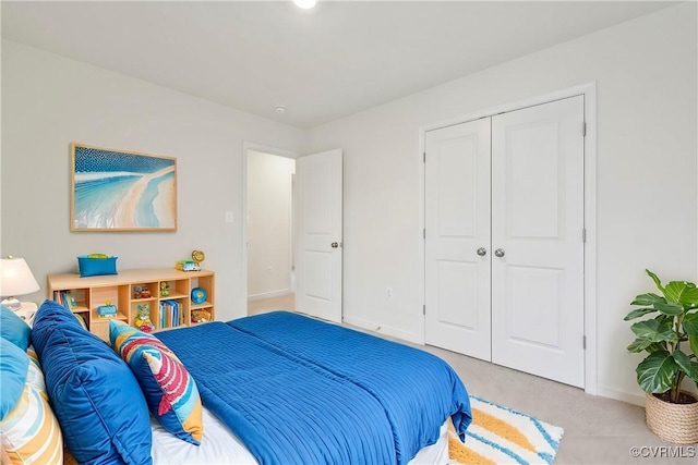 carpeted bedroom featuring a closet