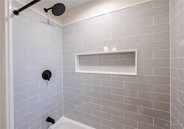 bathroom with washtub / shower combination