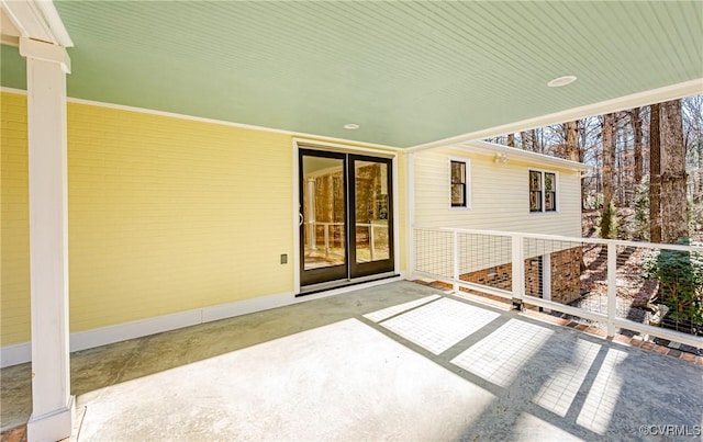 view of patio featuring a balcony