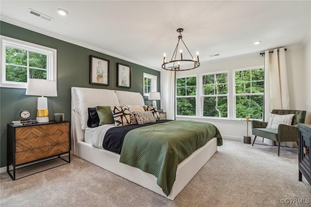 carpeted bedroom with a notable chandelier and ornamental molding