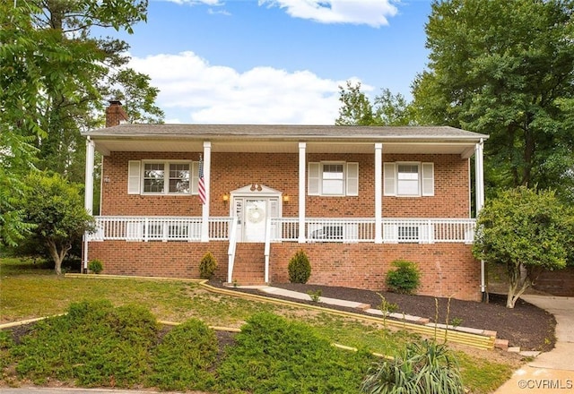 view of front of home featuring covered porch and a front lawn