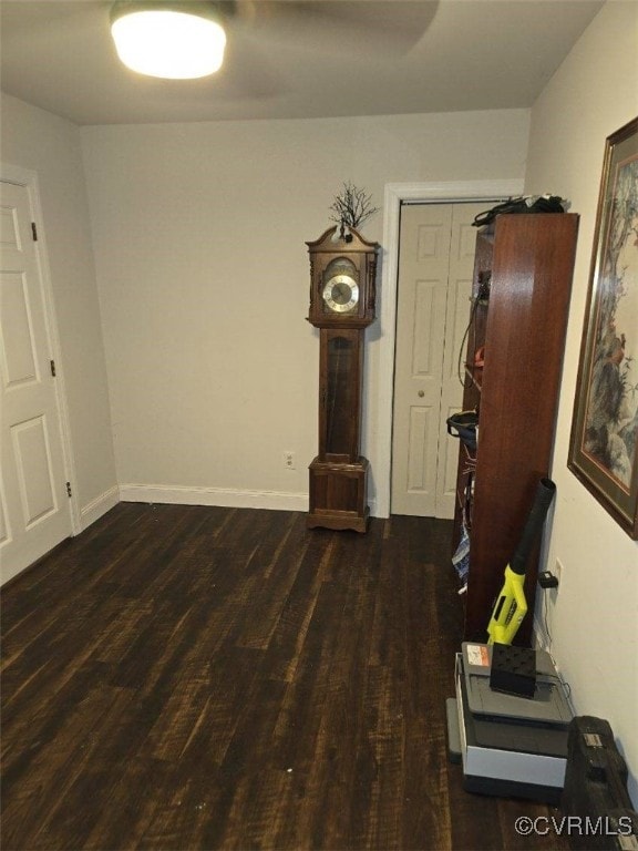 unfurnished living room with dark hardwood / wood-style flooring