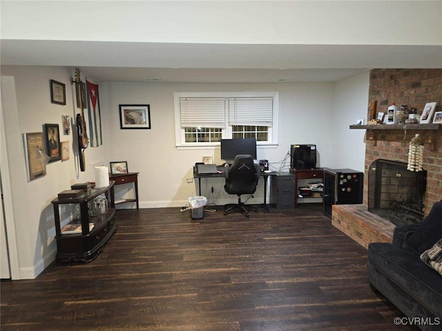 office space featuring dark wood-type flooring and a fireplace