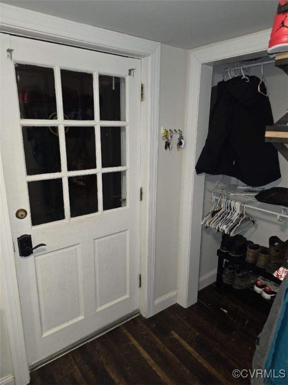 entryway with dark wood-type flooring