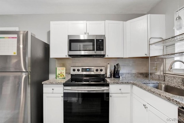 kitchen with white cabinetry, sink, and stainless steel appliances