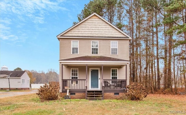 view of front facade with a front lawn and a porch