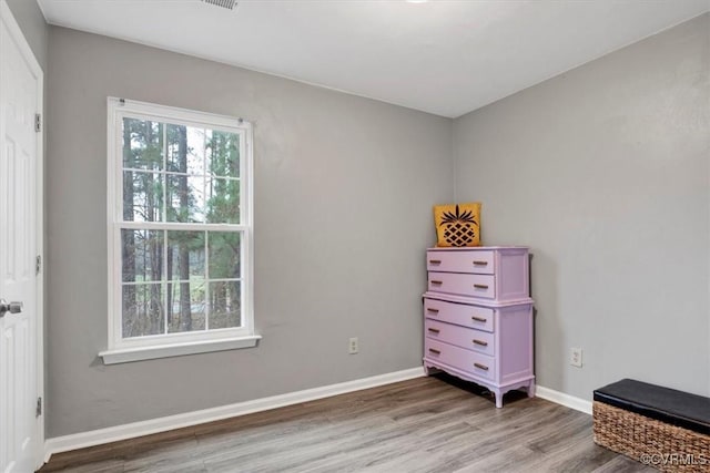 bedroom with hardwood / wood-style floors