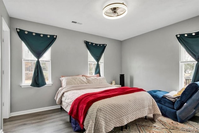 bedroom with hardwood / wood-style floors