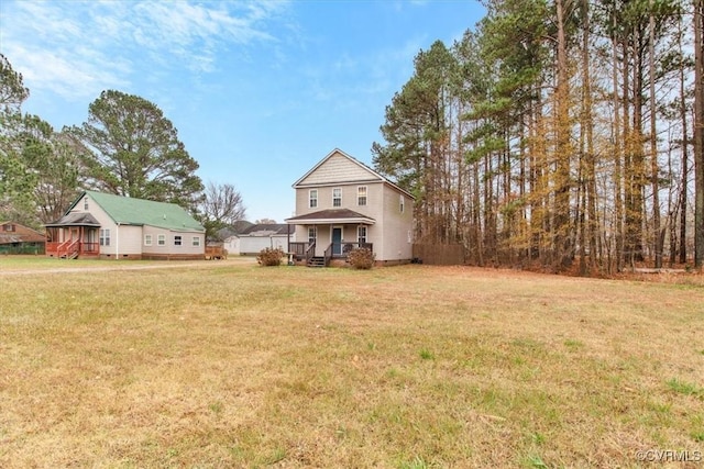 view of front facade featuring a front lawn and a porch