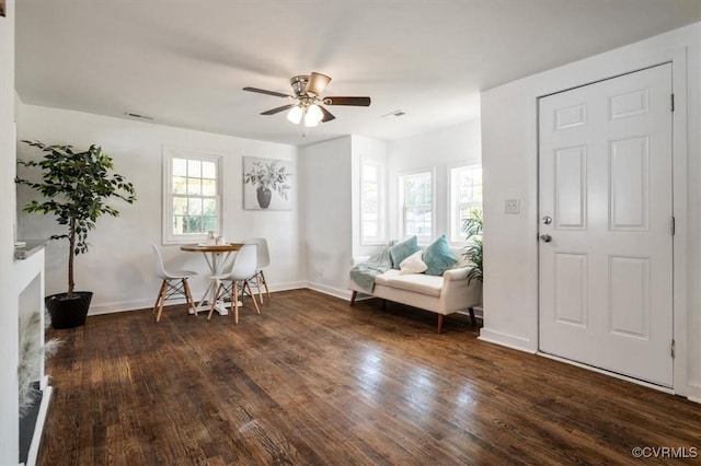 foyer with ceiling fan and dark wood-type flooring