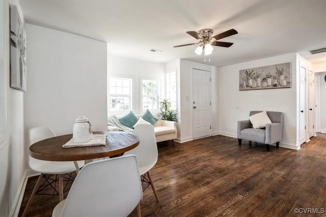 interior space featuring ceiling fan and dark hardwood / wood-style floors