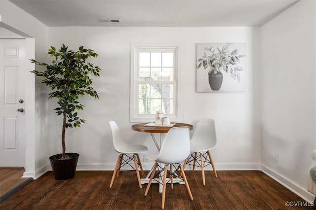 dining room featuring dark hardwood / wood-style flooring