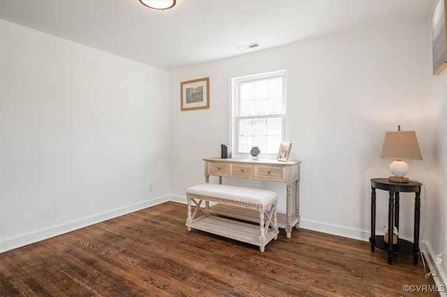 sitting room featuring dark hardwood / wood-style flooring