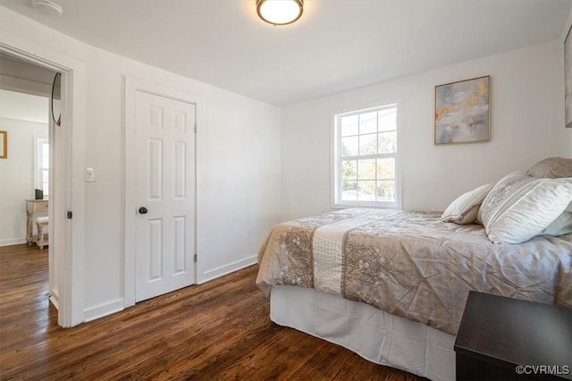 bedroom featuring dark wood-type flooring