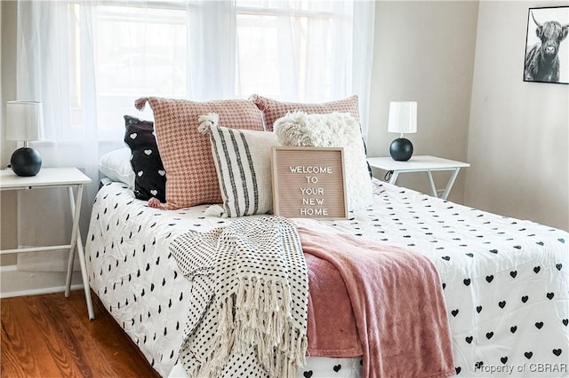 bedroom featuring dark wood-type flooring