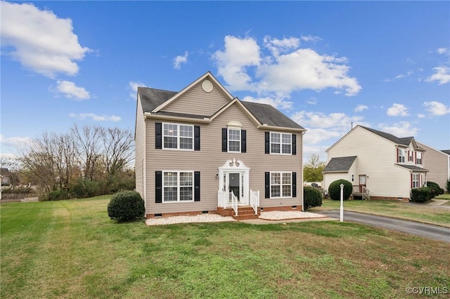 colonial home with a front yard