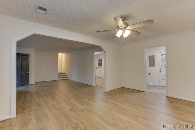 unfurnished room with ornamental molding, electric panel, and light hardwood / wood-style flooring