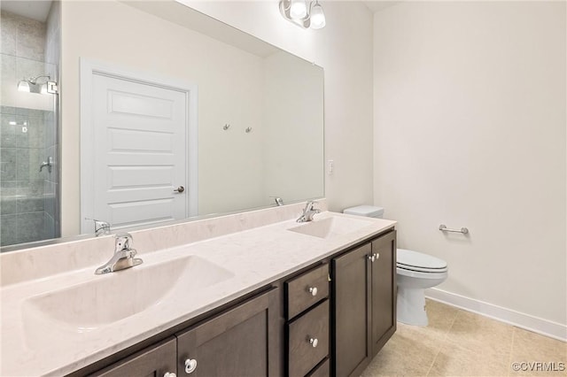 bathroom with tile patterned flooring, vanity, toilet, and a shower with shower door