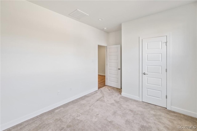 unfurnished bedroom with light colored carpet